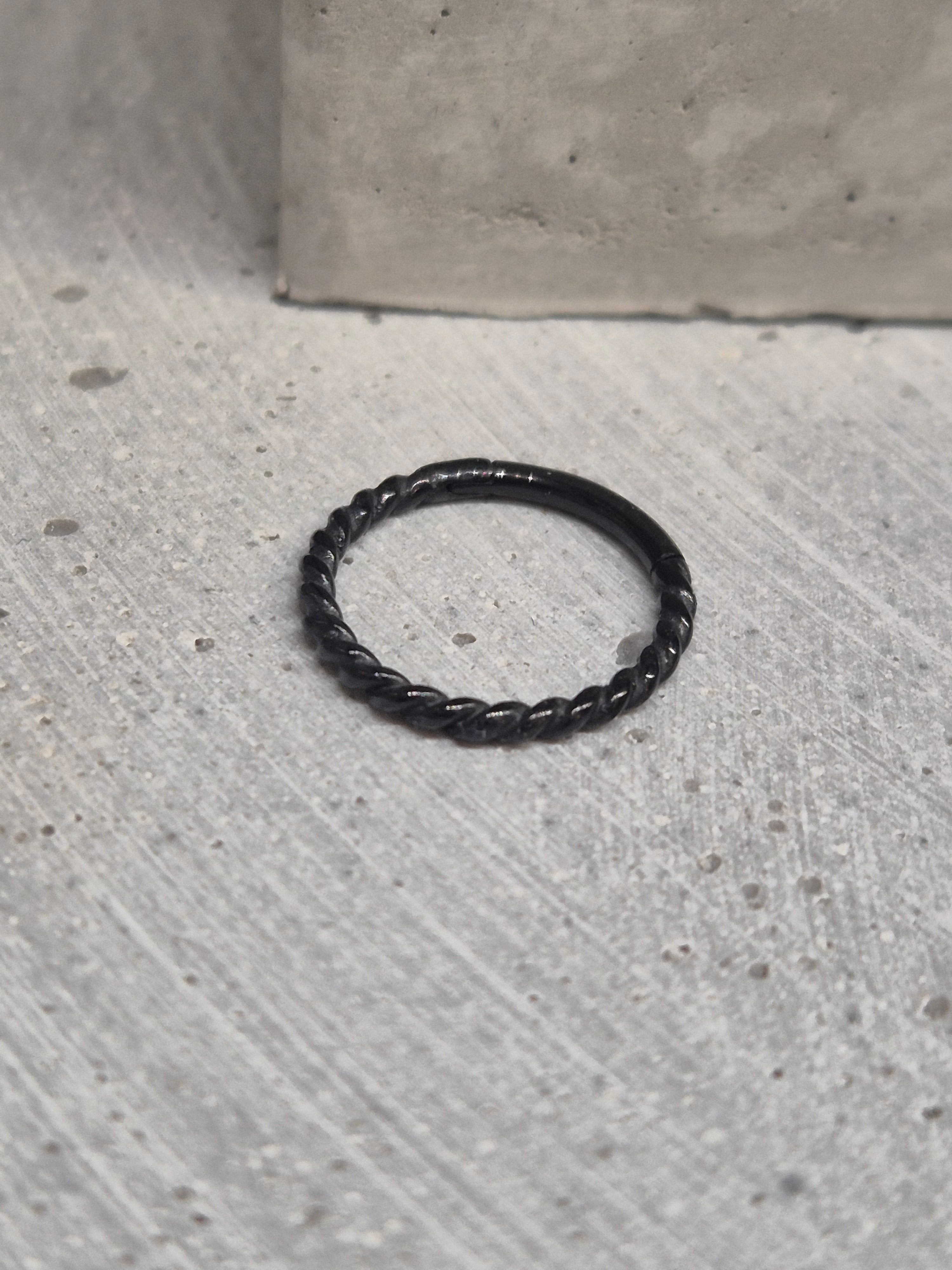 Hinged twisted segment ring