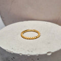 Hinged twisted segment ring